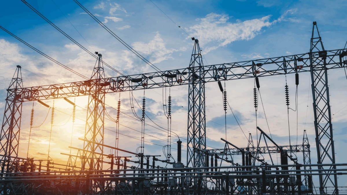 Power substation and transmission towers at sunset